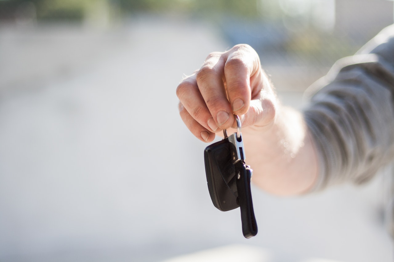 car keys being handed to owner